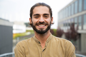 Smiling Dallas patient with natural-looking dental crown
