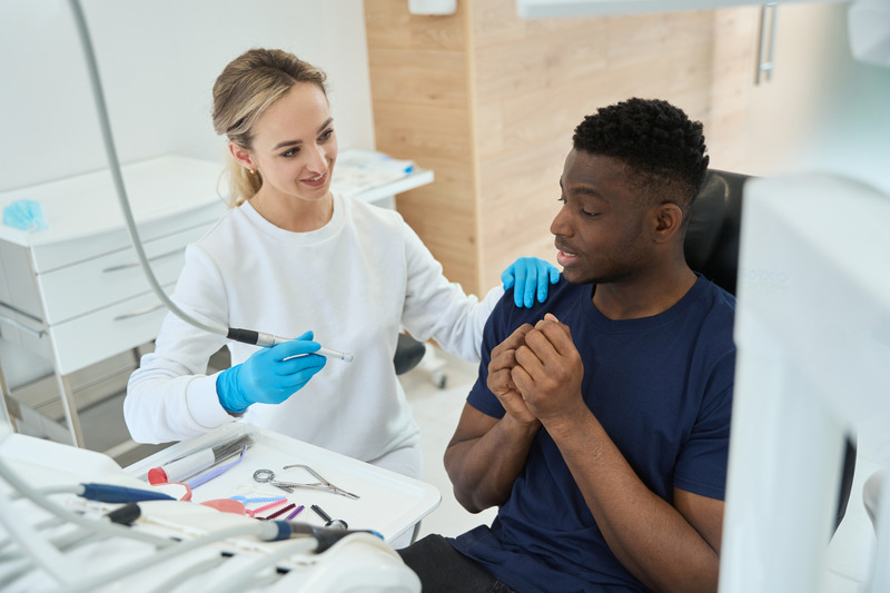 Anxious patient with dentist about to get dental implants